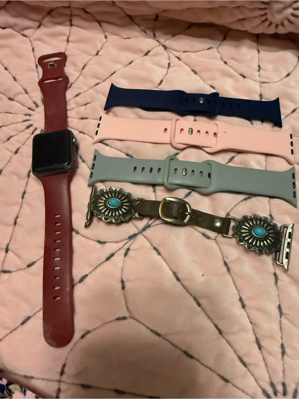 Apple Watch with Red Case and Navy, Pink, Gray, Turquoise-Accented Bands